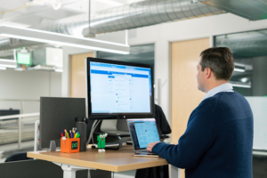 A sales and marketing team reviews video engagement data together — the kind of real-time signal manufacturers use to shorten the gap between first touch and closed deal.