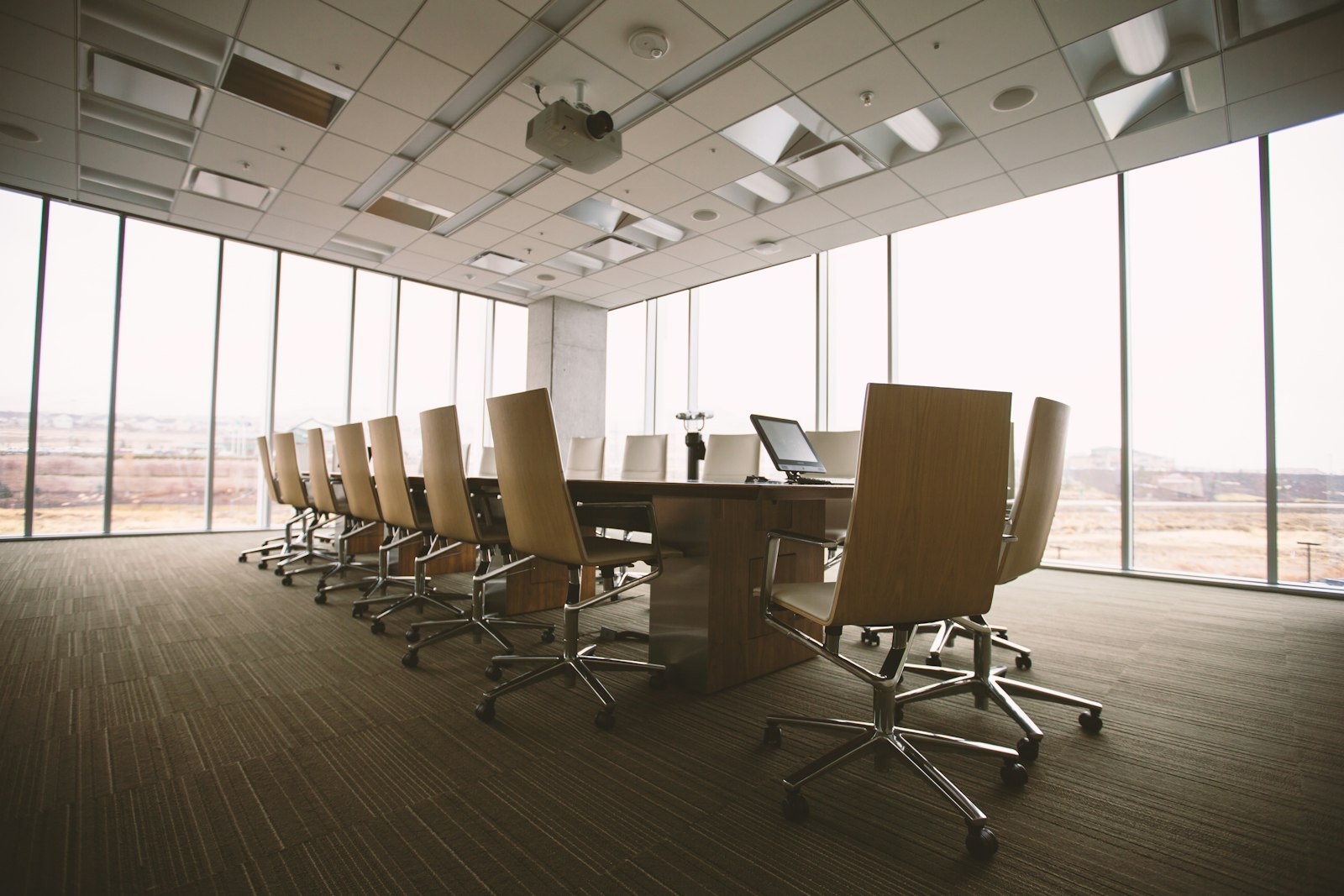 Empty boardroom with a conference table and city view Empty boardroom with a conference table and city view