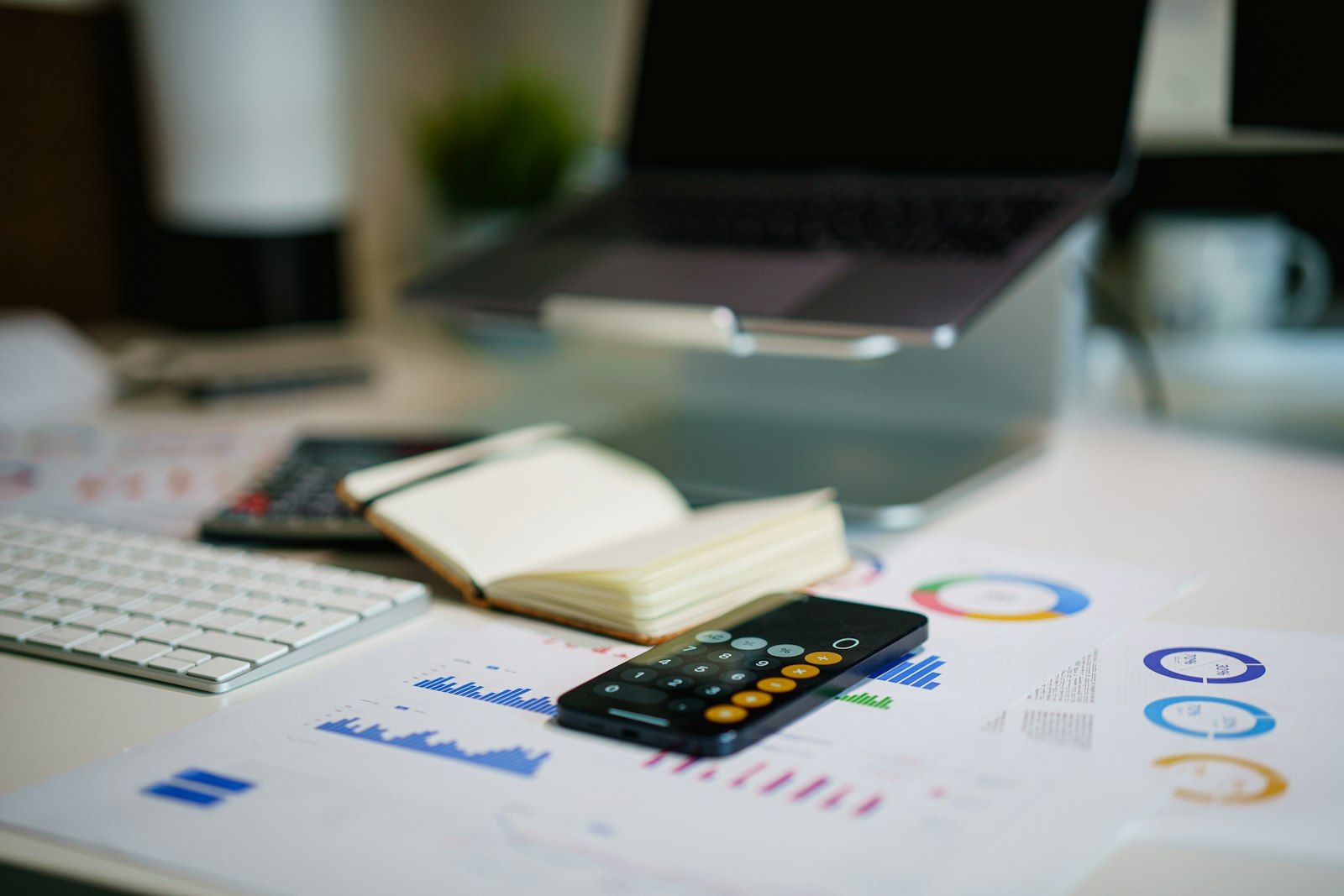 Financial charts and calculator used for pricing analysis